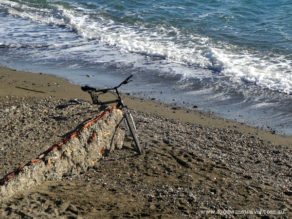 Bike on beach in Pedregalejo, near Malaga, Spain