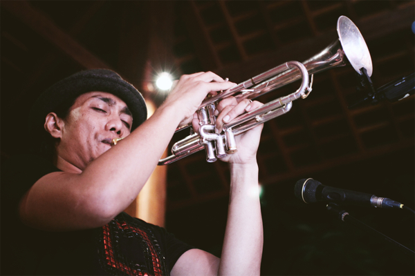 Rio Sidik (playing trumpet), one of the musicians performing at the inaugural Ubud Village Jazz Festival.