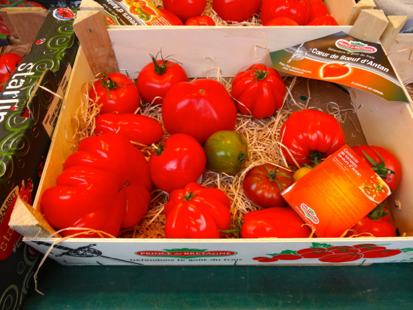 Heirloom tomatoes at fresh food market at Conflans Ste Honorine by the Seine River near Paris.