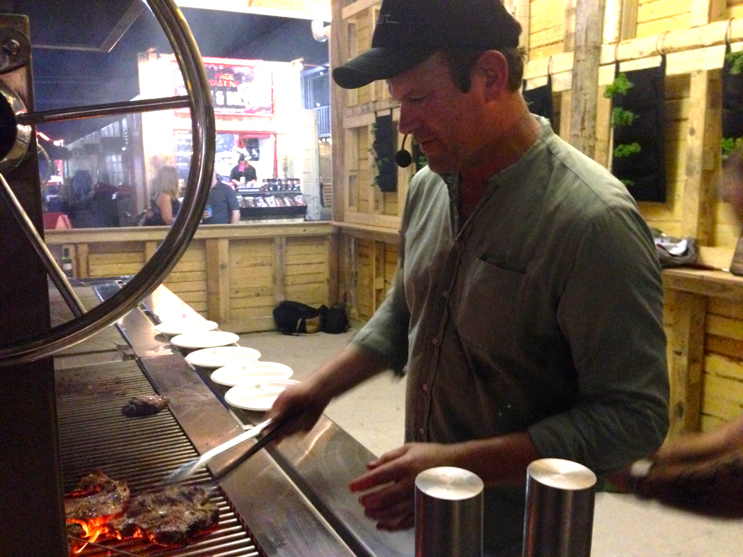 Celebrity chef Ben O'Donoghue cooking in the Backyard at Night Quarter.