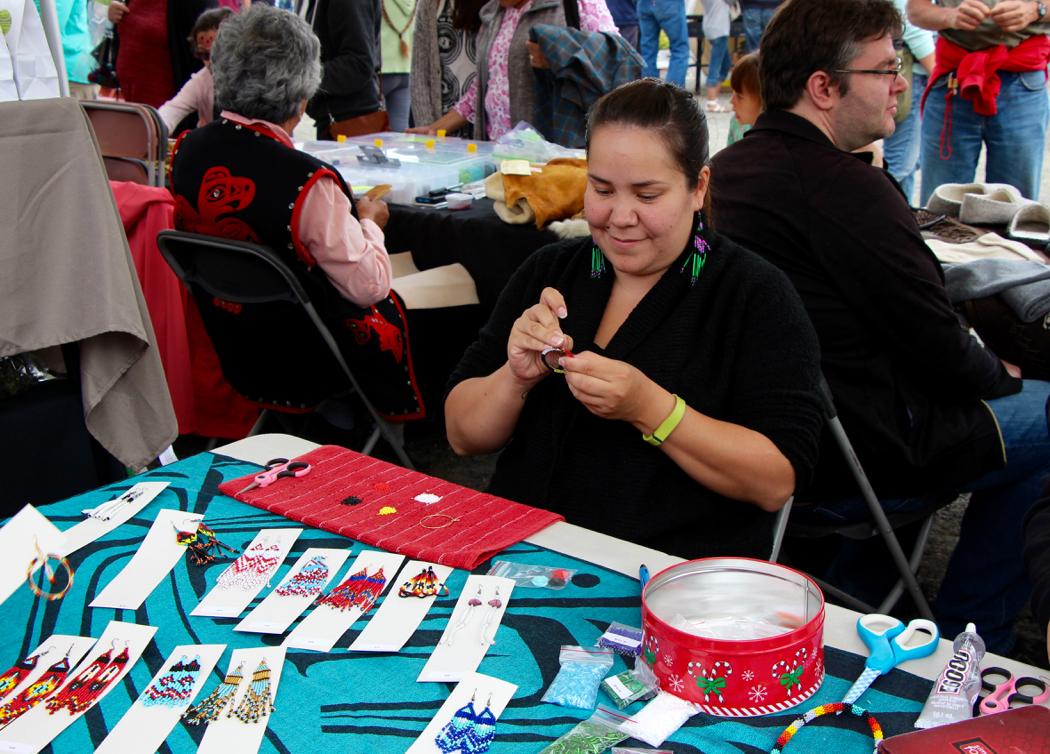 Beading during the craft fair on National Aboriginal Day.