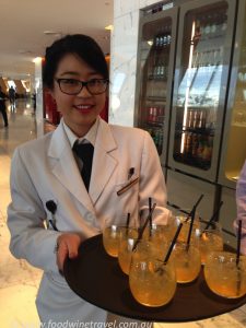 Woman with cocktails made from Qantas honey