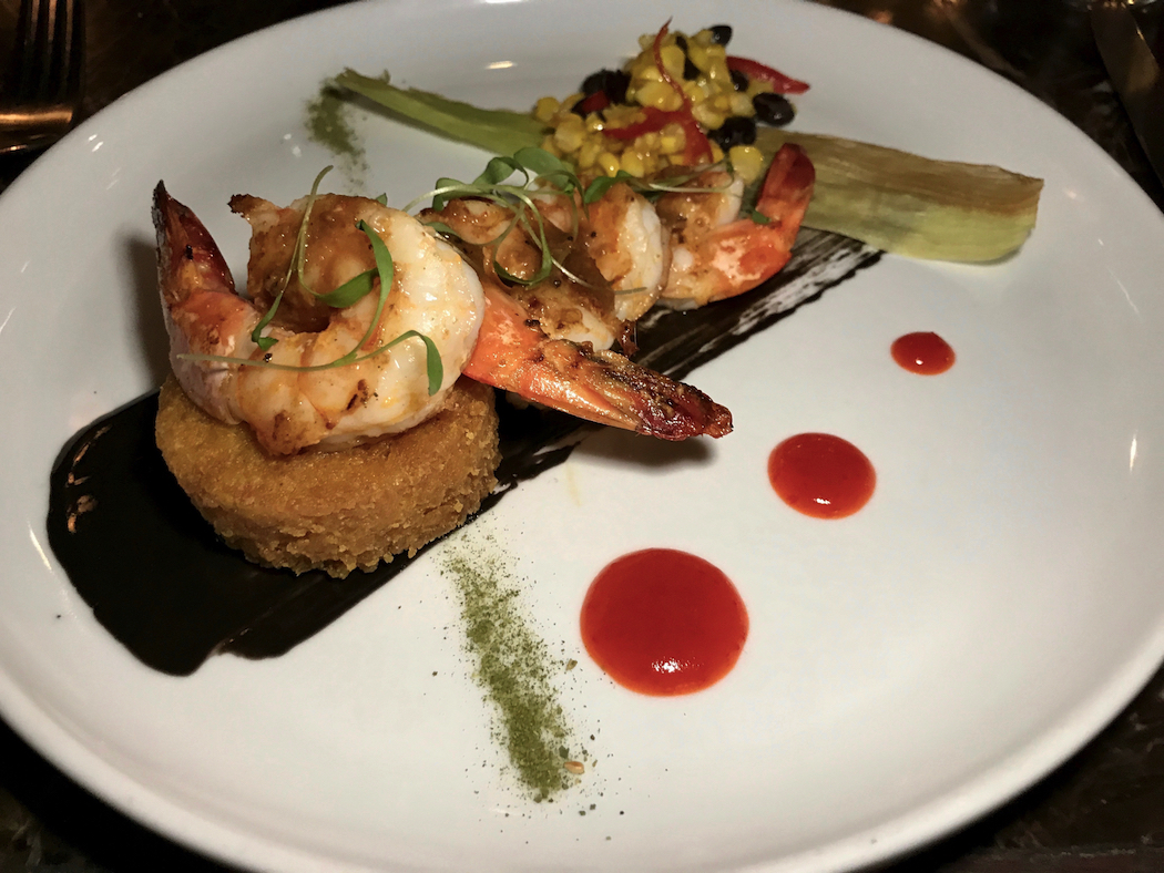 Fins Restaurant King prawns from the Tweed served with a crispy turmeric and coconut rice cake, chilli jam, and barbecued corn with lemon aspen butter