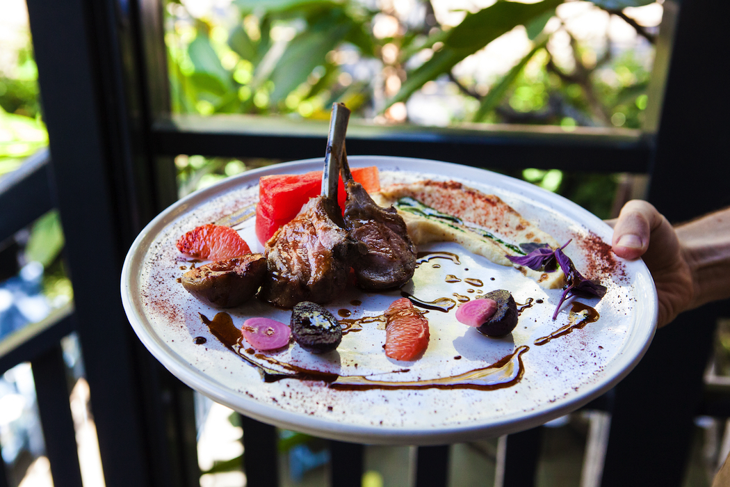 Roasted rack of lamb with beetroot, pink grapefruit, salted watermelon and a puree of celeriac and fig leaves .