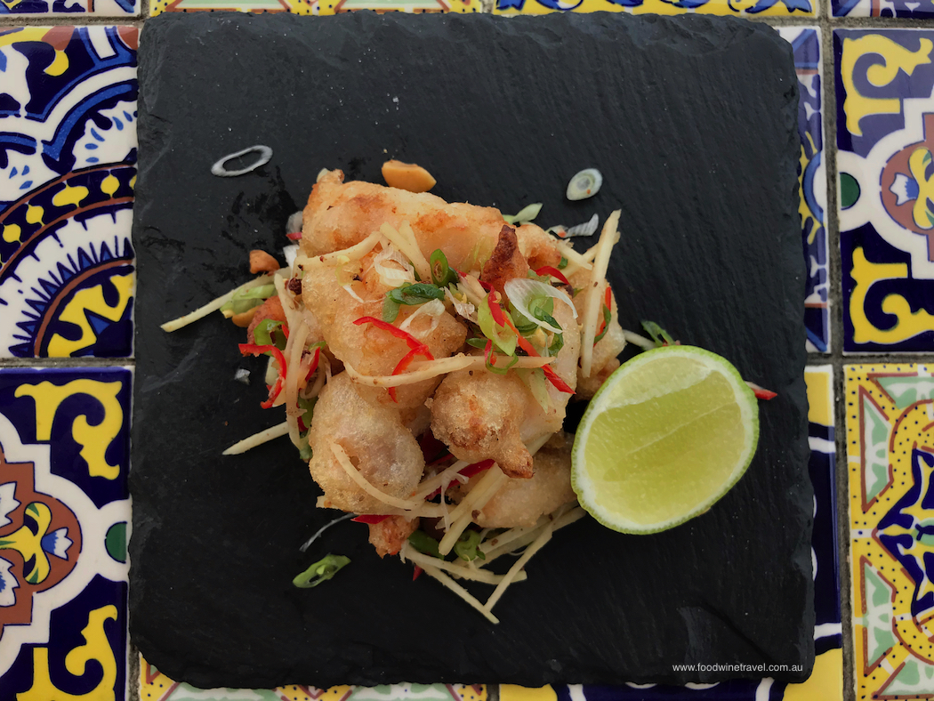 Suttons Beach Pavilion Salt and pepper king prawns with ginger spring onion chilli and macadamia nut dressing