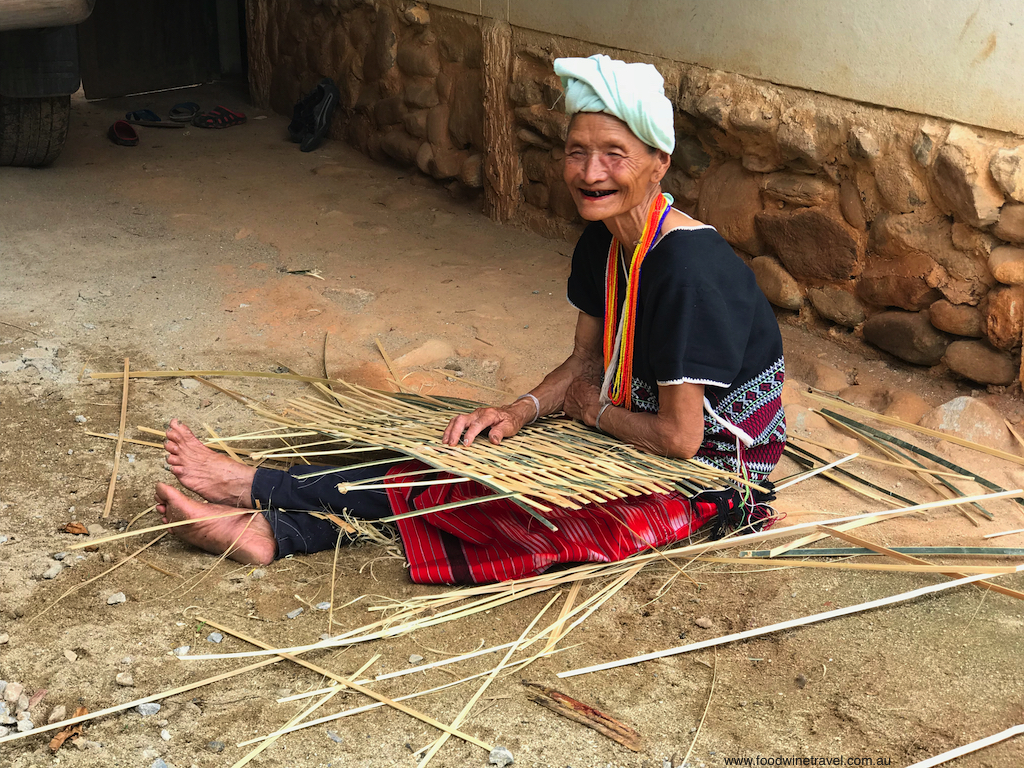 A Karen woman making a fence to keep in chickens.