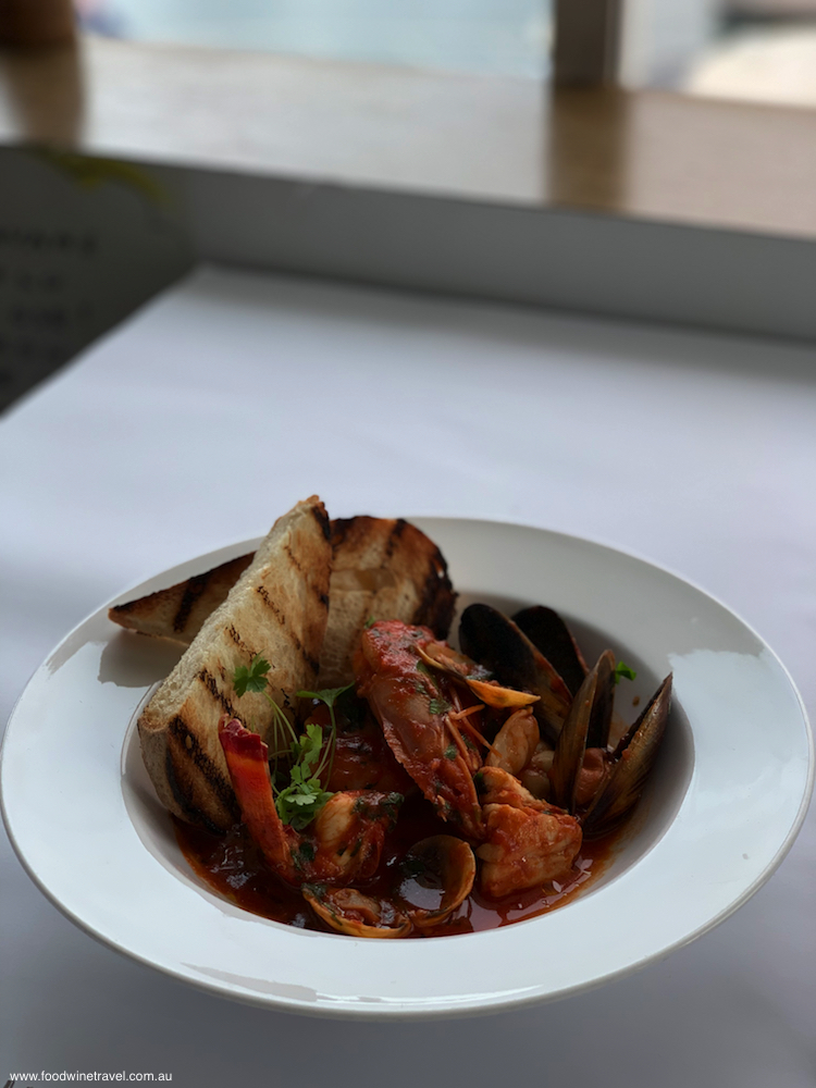 The seafood soup is replete with mussels, prawns, scallops and cockles.