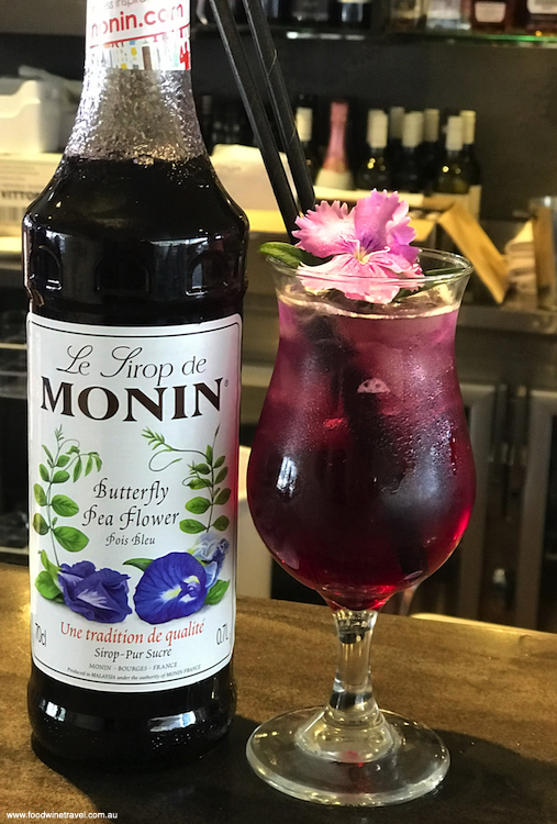 Monin's dessert cocktail of vodka, butterfly pea, soda and ice.