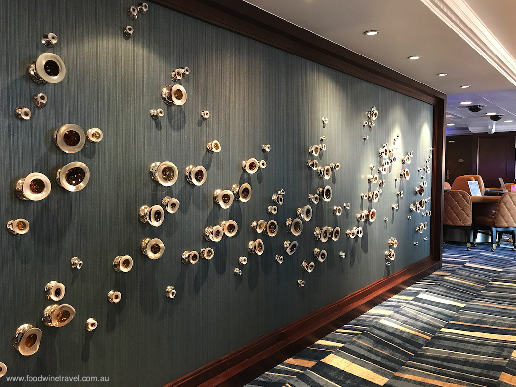 A wall of hand-blown glass barnacles and sea life, created by Californian artist Michael Skura.