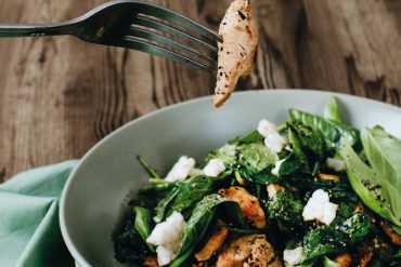 Recipe for Stir-fried chicken and basil salad on just-wilted spinach, from Eat Your Way Slim & Healthy.