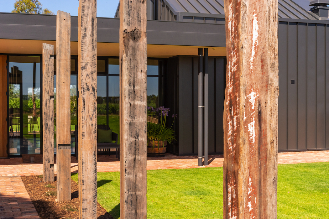 A recycled timber arbour leads to the tasting room. Photo: John Krüger.