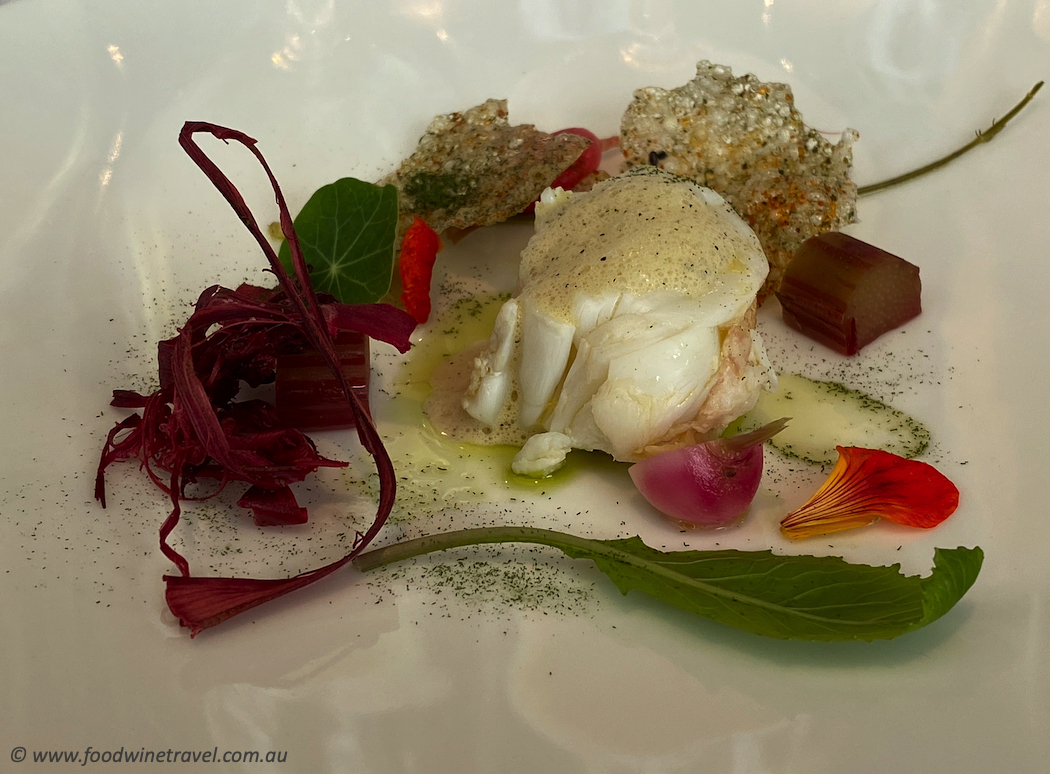 Lightly poached Tasmanian rock lobster with rhubarb and celery emulsion, compressed heirloom vegetables, and nasturtium.