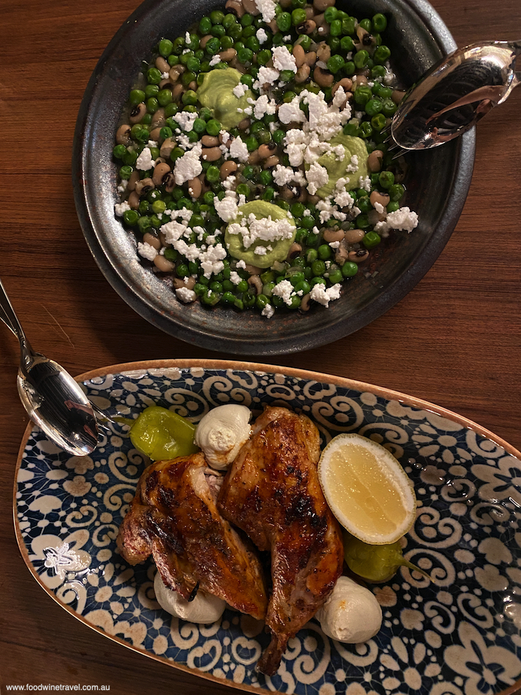 Grilled organic chicken with almond skordalia, and a side of braised peas.