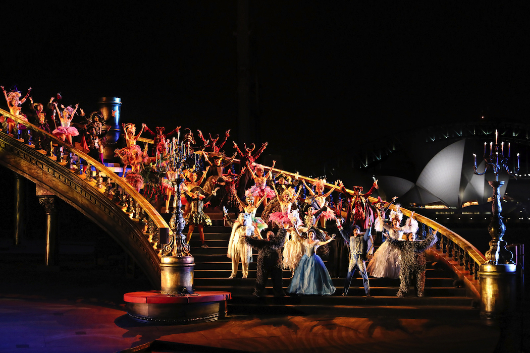 The grand staircase features in a lavish over-water stage set.