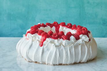 Make this show-stopping Raspberry Pavlova with aquafaba. Recipe from Simply Vegan Baking.