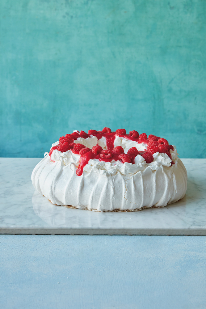 Make this show-stopping Raspberry Pavlova with aquafaba. Recipe from Simply Vegan Baking.