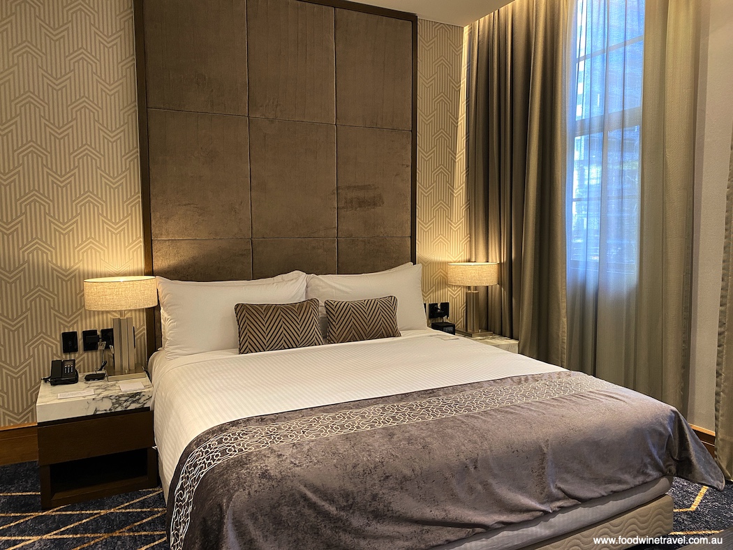 Our sixth-floor king bed suite with its plush blue and gold carpet.