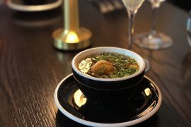 First brunch course: Peking duck tortellini and edamame in a Peking duck broth.