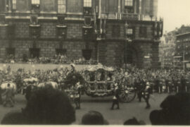 Queen Elizabeth II passing by in the Gold State Coach.