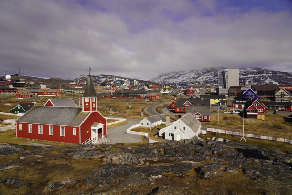 The capital of Greenland, Nuuk, viewed from the Hans Egede statue with the Church of Our Saviour in the foreground.