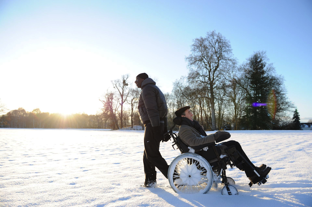 Wealthy Philippe hires ex-convict Driss as his caregiver in The Intouchables.