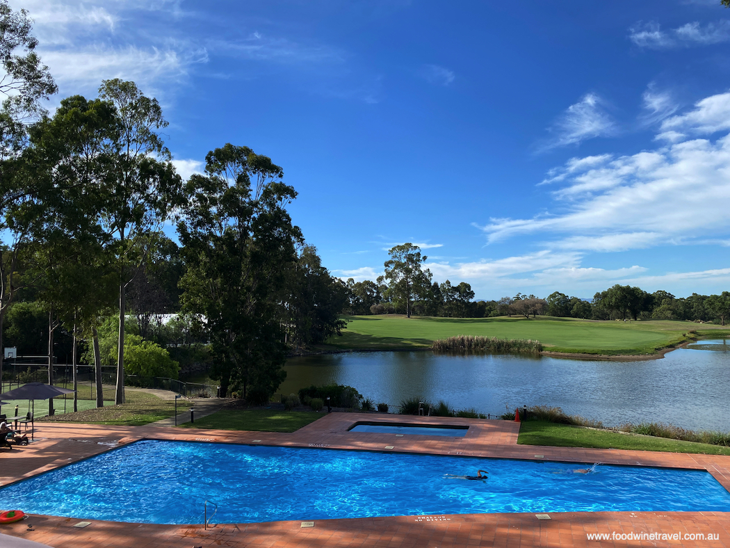 Pool and golf course views from the Clubhouse at Oaks Cypress Lakes Resort.