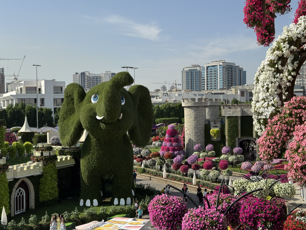 Cute elephants against a city backdrop
