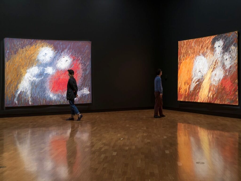 Installation view, Arthur Boyd: Tapestries, National Gallery of Australia, Kamberri/Canberra, 2026, featuring (left to right): Arthur Boyd, Manufactura de Tapeçarias de Portalegre, Juliana Calha (draughtsman (intermediary)), The gift of a lamb, 1974; Arthur Boyd, Manufactura de Tapeçarias de Portalegre, Lurdes Branquinho (draughtsman (intermediary)), St Clare showing her shaven head to her family, 1974, purchased 1975, Arthur Boyd’s work reproduced with the permission of Bundanon Trust
