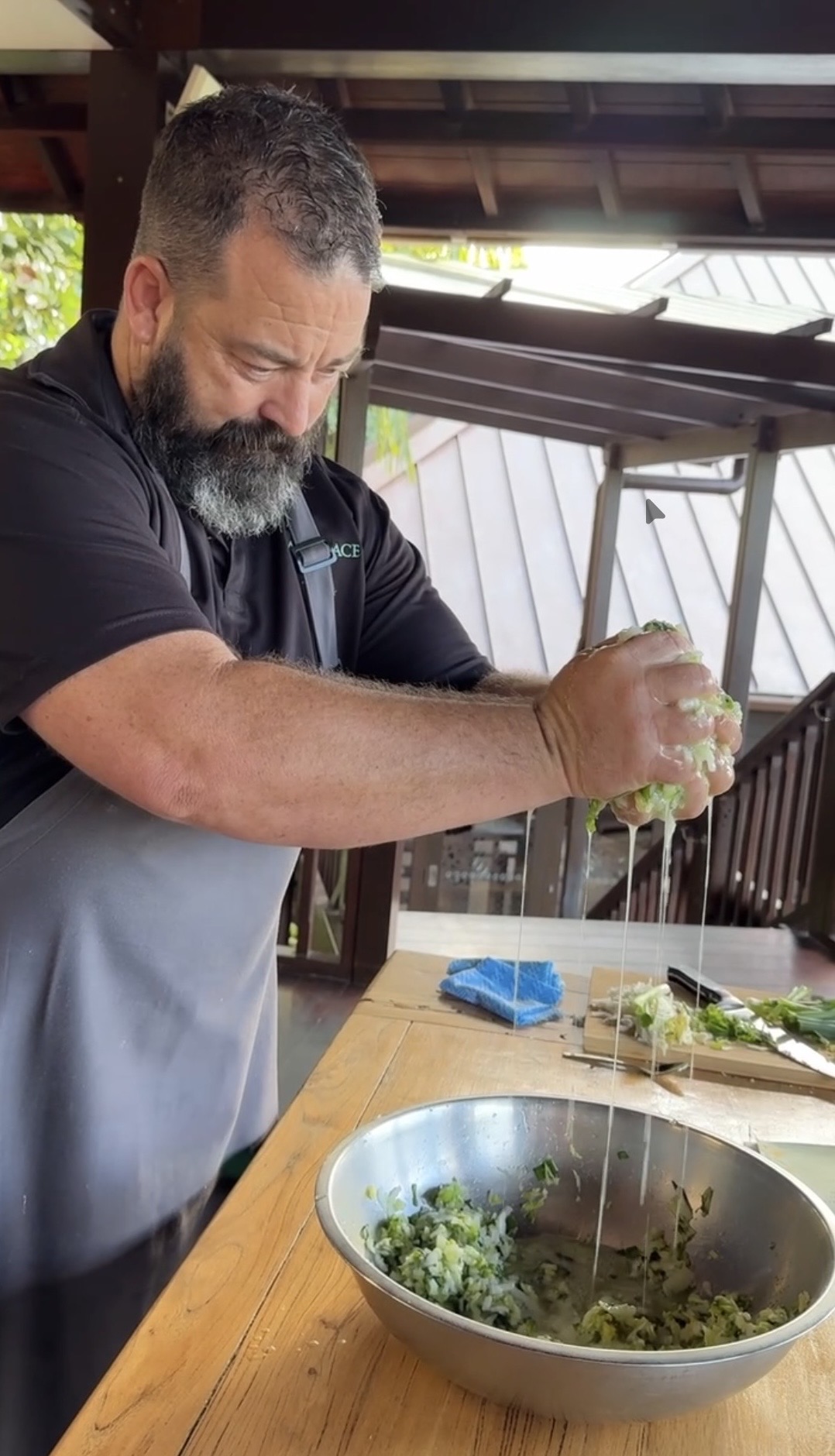 Makepeace Island executive chef Zeb Gilbert shows how to squeeze the water from the cabbage.