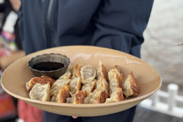 Gyozas, the finished product, served to us with ponzu dipping sauce.
