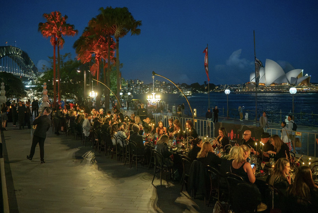 Dîner en Noir as the sun sets over Sydney Harbour.